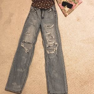 Straight leg ripped blue jeans in size 24! A zipper used to do it up!